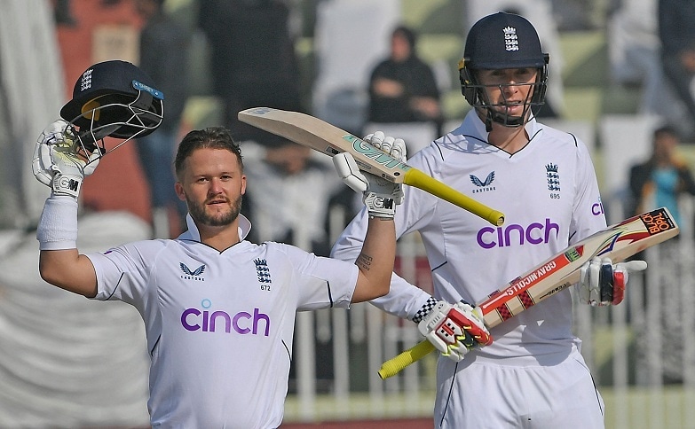 England’s Ben Duckett (L) celebrates after scoring a century (100 runs) next to his teammate Zak Crawley (R) during the first day of the first Test match between Pakistan and England at the Rawalpindi Cricket Stadium on Thursday.  — AFP