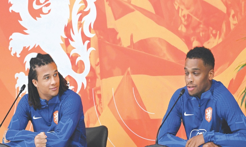 DOHA: Dutch players Nathan Ake (L) and Jurrien Timber attend a press conference at Qatar University training sites on Tuesday.—AFP DOHA: Dutch players Nathan Ake (L) and Jurrien Timber attend a press conference at Qatar University training sites on Tuesday.—AFP