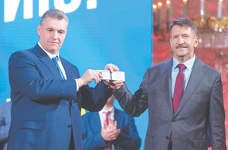 Leonid Slutsky, the leader of Russia&rsquo;s Liberal Democratic Party (left), and Viktor Bout showing his membership card at a convention of the party in Moscow.&mdash;AFP