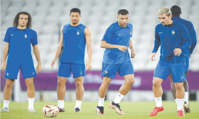 DOHA: (From R) France&rsquo;s Antoine Griezmann, Kylian Mbappe, William Saliba and Matteo Guendouzi take part in a training session at the Al Sadd SC on Tuesday.&mdash;AFP