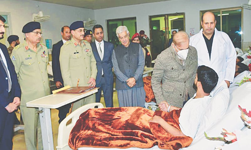 RAWALPINDI: Prime Minister Shehbaz Sharif meets officers and soldiers at the Combined Military Hospital on Thursday. The army personnel were injured during the operation to clear the CTD complex in Bannu.—PPI