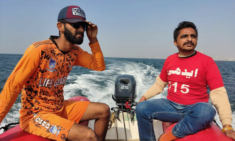 An Edhi Rescue official and a life guard conducting a rescue operation on Saturday to search for a 23-year-old woman feared to have drowned at Karachi’s Seaview. — Photo provided by author