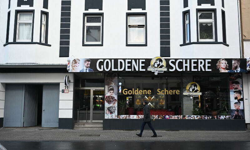 A man walks past a house in Castrop-Rauxel, western Germany, Jan 8, where police arrested a 32-year-old Iranian man on suspicion of &ldquo;having prepared a serious act of violence threatening the security of the state by obtaining cyanide and ricin with a view to committing an Islamist attack&rdquo;. &mdash; AFP