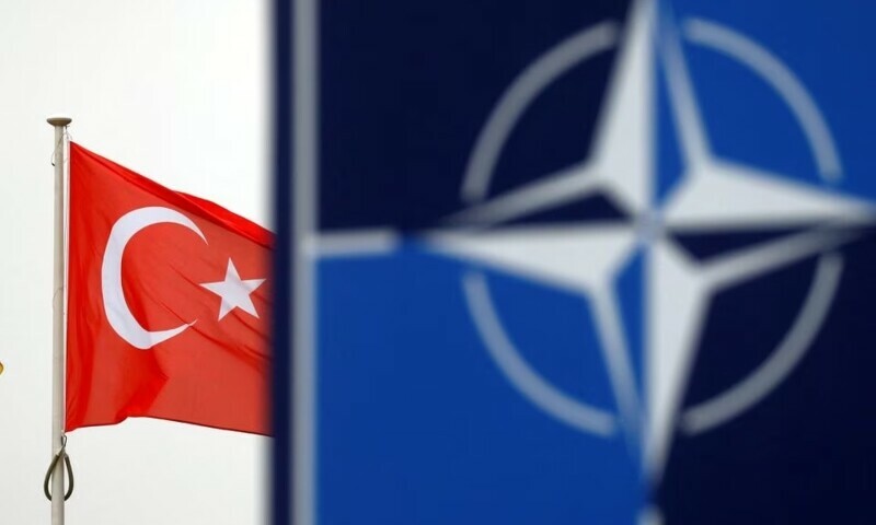 A Turkish flag flies next to Nato logo at the Alliance headquarters in Brussels, Belgium, November 26, 2019. — Reuters A Turkish flag flies next to Nato logo at the Alliance headquarters in Brussels, Belgium, November 26, 2019. — Reuters