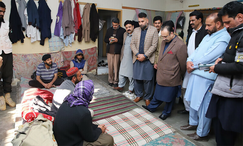 AJK Prime Minister Sardar Tanveer Ilyas interacts with prisoners during a surprise visit of the Central Jail on the outskirts of Muzaffarabad.— Photo by author