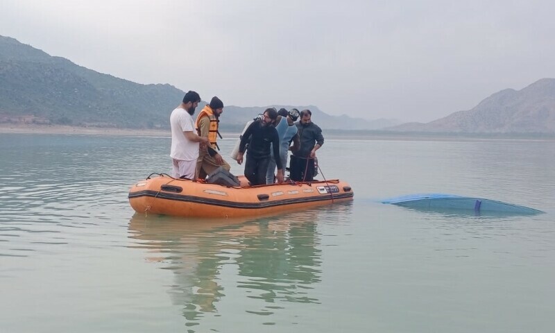 Rescue operation under way at KP’s Tanda Dam lake after a boat, carrying students, capsized on Sunday. — Photo by Siraj