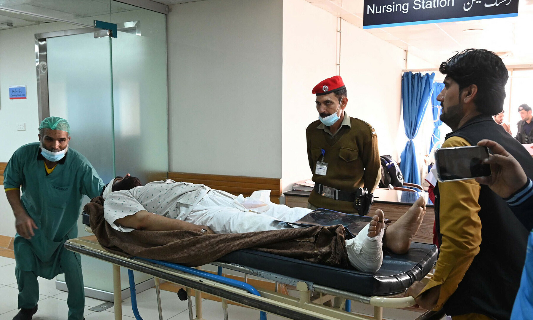 A wounded policeman gets treated at a government hospital a day after the mosque blast inside the police headquarters in Peshawar on January 31, 2023. —Photo by Abdul Majeed/AFP