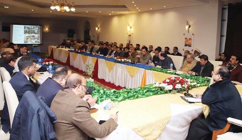 AJK Prime Minister Sardar Tanveer Ilyas chairs a meeting in Mirpur to review progress on development projects, with ministers and senior government officials among the attendees. — Photo by author