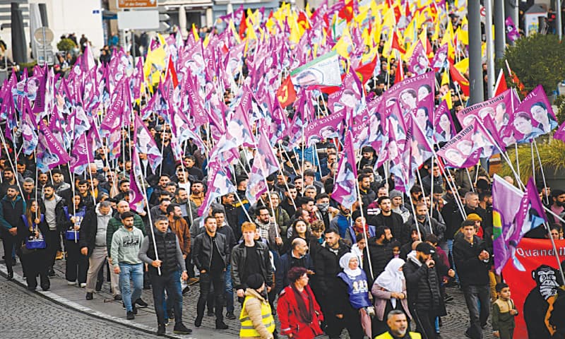 People take part in a tribute march in the memory of three Kurdish activists, who were murdered in January 2013, in Marseille, on Saturday.&mdash;AFP