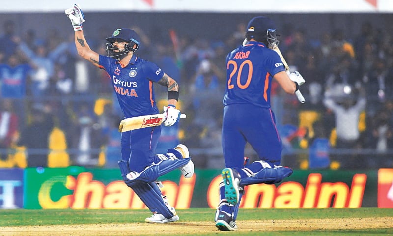 INDIAN batter Virat Kohli celebrates scoring the century while running between the wickets along with Axar Patel during the first ODI against Sri Lanka on Tuesday. —AFP