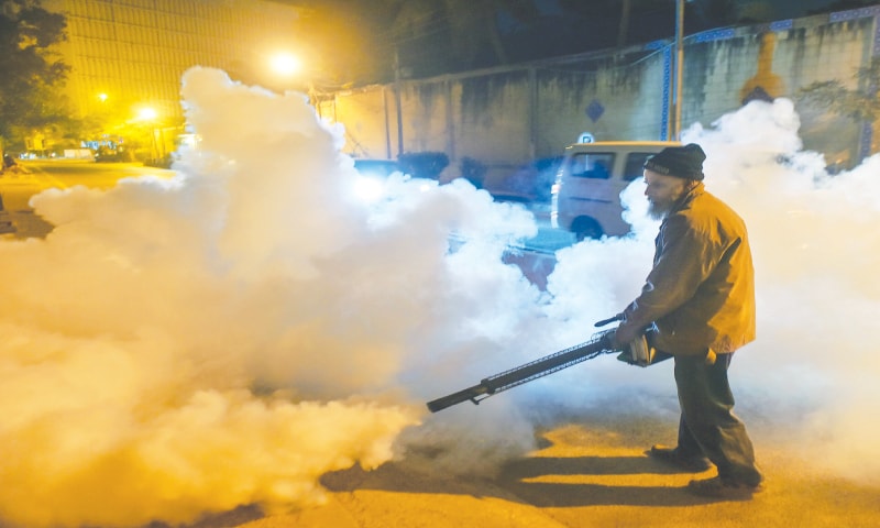 While malaria cases are increasing in the province, a health worker carries out fumigation outside Chief Minister House.&mdash;Fahim Siddiqi / White Star