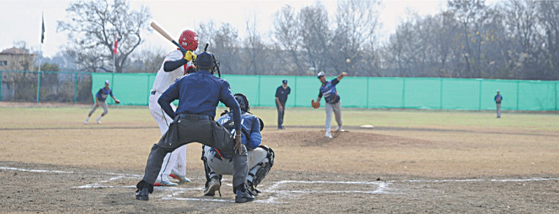 ISLAMABAD: Players in action during the West Asia Baseball Cup match between Bangladesh and Afghanistan at the Pakistan Sports Complex on Sunday.—courtesy PFB