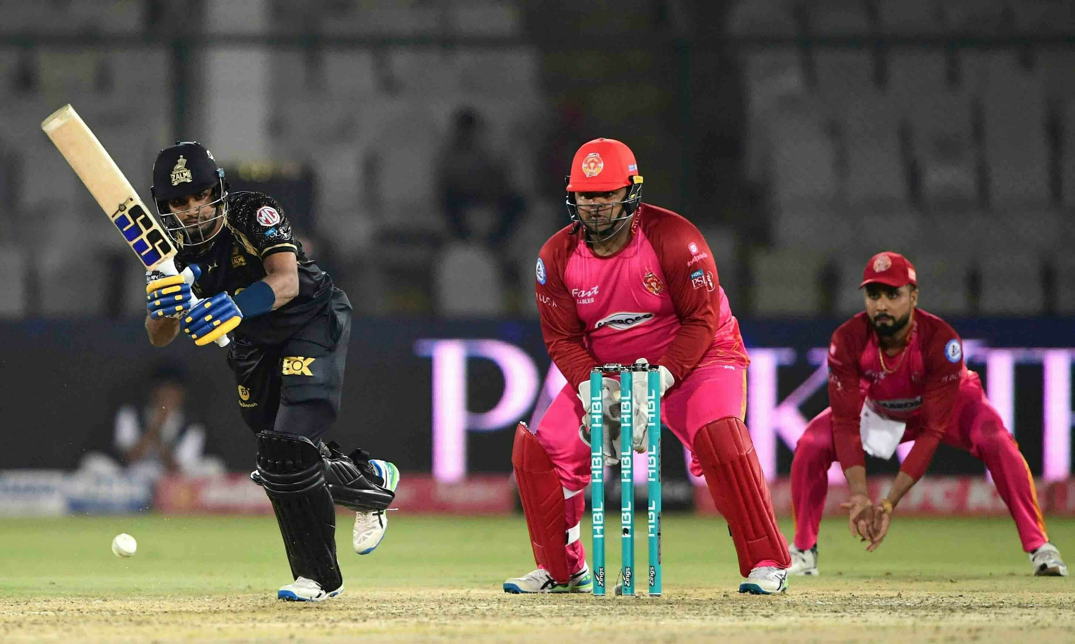 Peshawar Zalmi’s Dasun Shanaka (L) plays a ashot during the Pakistan Super League (PSL) T20 cricket match between Peshawar Zalmi and Islamabad United at the National Stadium in Karachi on February 23. — AFP