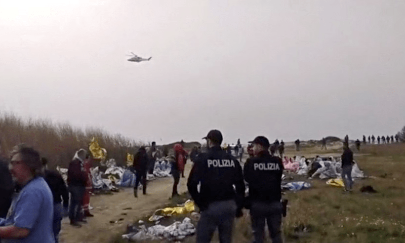 A screengrab taken from a video shows police officers standing at the beach where bodies of believed to be refugees were found after a shipwreck, in Cutro, the eastern coast of Italy’s Calabria region, Italy, February 26. — Reuters