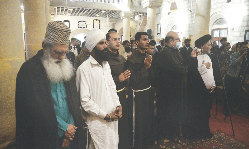 Displaying interfaith harmony, leaders and practitioners of different religions and schools of thought pray for Kashmiris and their freedom, in a meeting held in Holy Trinity Cathedral on Sunday.—Shakil Adil / White Star