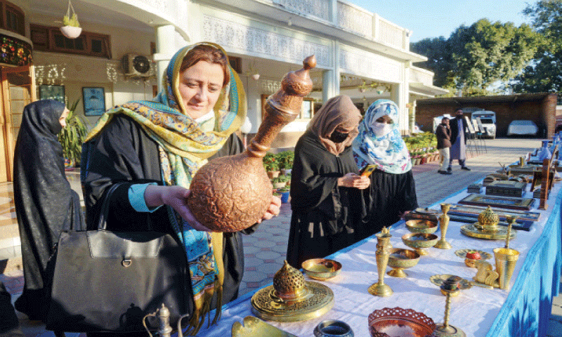 Visitors show interest in handicrafts put on display during a three-day Iranian cultural show arranged at the Khana-i-Farhang, Peshawar, on Tuesday to mark 44th anniversary of the Islamic Revolution. — White Star