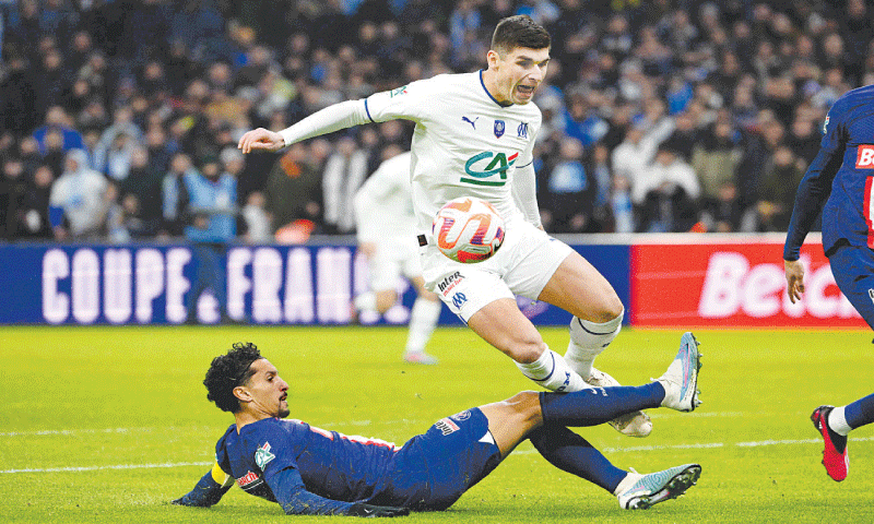 PARIS St-Germain’s Marquinhos (bottom) tackles Ruslan Malinovskyi of Olympique de Marseille during their Coupe de France round-of-16 match at Stade Velodrome.—AFP PARIS St-Germain’s Marquinhos (bottom) tackles Ruslan Malinovskyi of Olympique de Marseille during their Coupe de France round-of-16 match at Stade Velodrome.—AFP