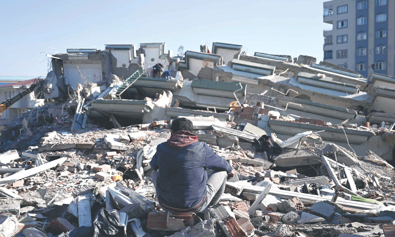 Kahramanmaras: A man sits among the rubble of collapsed buildings on Thursday, three days after a 7.8-magnitude earthquake struck southeast Turkiye.&mdash;AFP