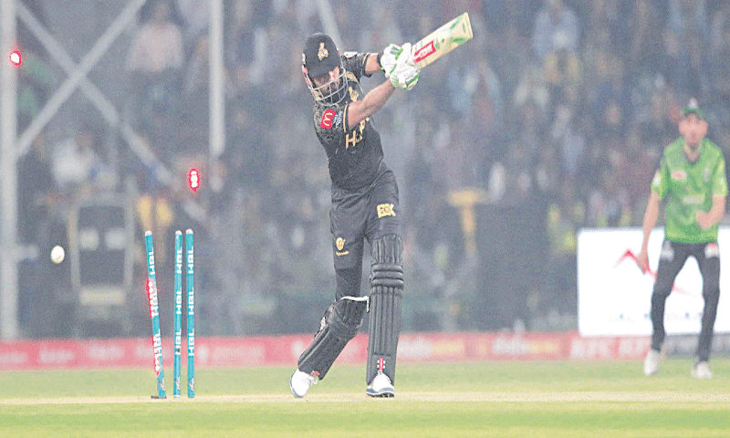 PESHAWAR Zalmi captain Babar Azam is cleaned up by Lahore Qalandars’ skipper Shaheen Shah Afridi during their HBL Pakistan Super League match at the Gaddafi Stadium on Sunday.—M.Arif/White Star