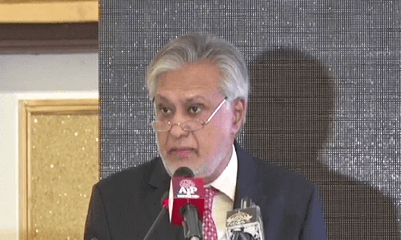 Finance Minister Ishaq Dar addresses a seminar in Islamabad on Thursday. — DawnNewsTV