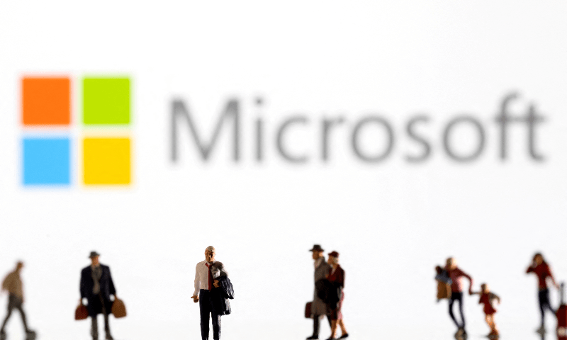 Small figurines are seen in front of displayed Microsoft logo in this illustration taken on February 11, 2022. — Reuters/File