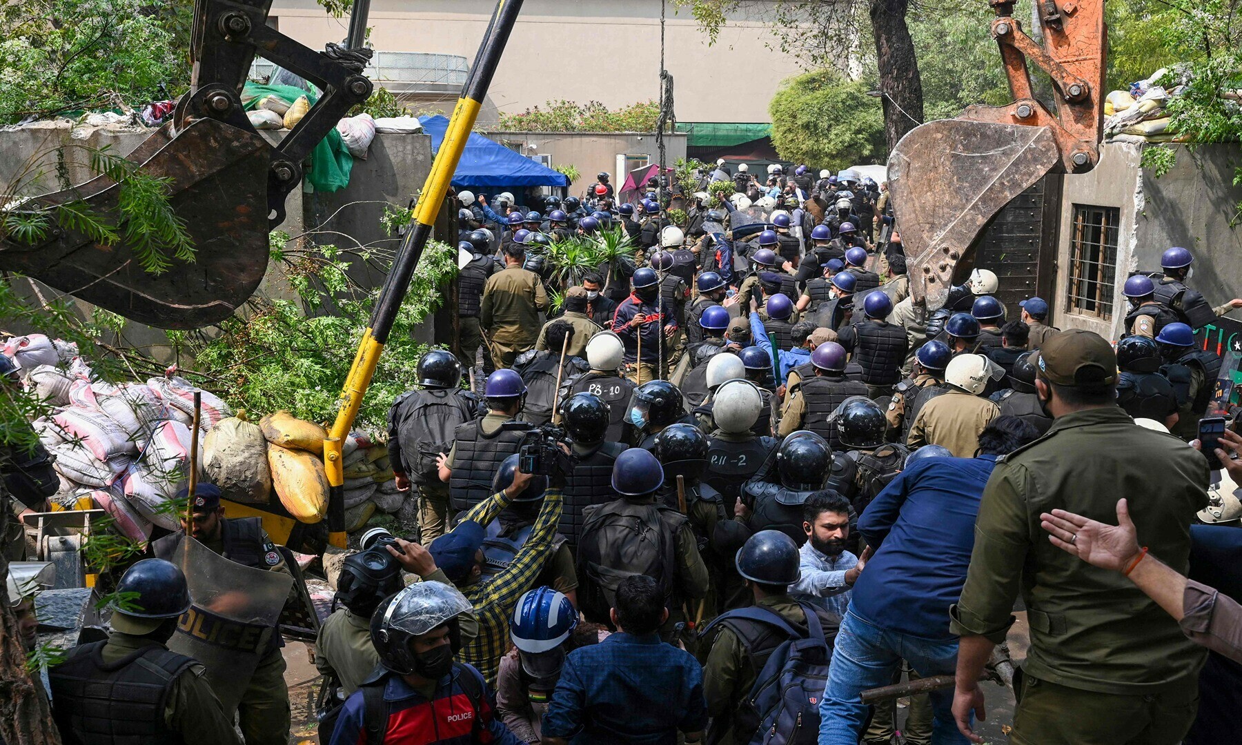 Riot police enter the residence of Pakistan’s former prime minister Imran Khan, in Lahore on March 18, 2023, after Khan left for Islamabad to appear in a court.— Photo by Arif Ali/AFP