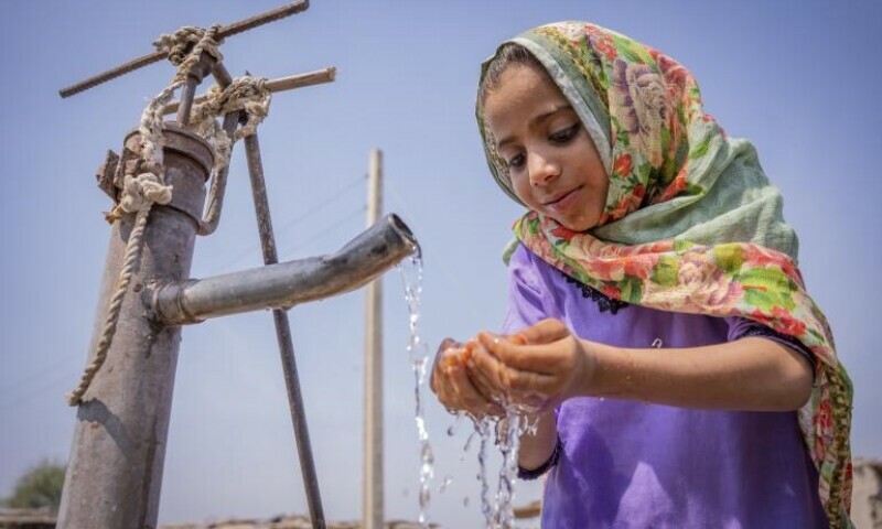 A child drawing water from a well. — Photo courtesy: Unicef