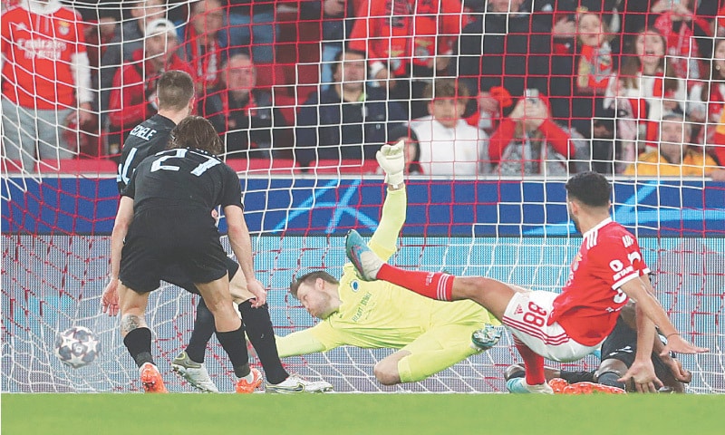 LISBON: Benfica’s Goncalo Ramos (R) scores against Club Brugge during their Champions League round-of-16 second leg at the Luz Stadium.—AFP