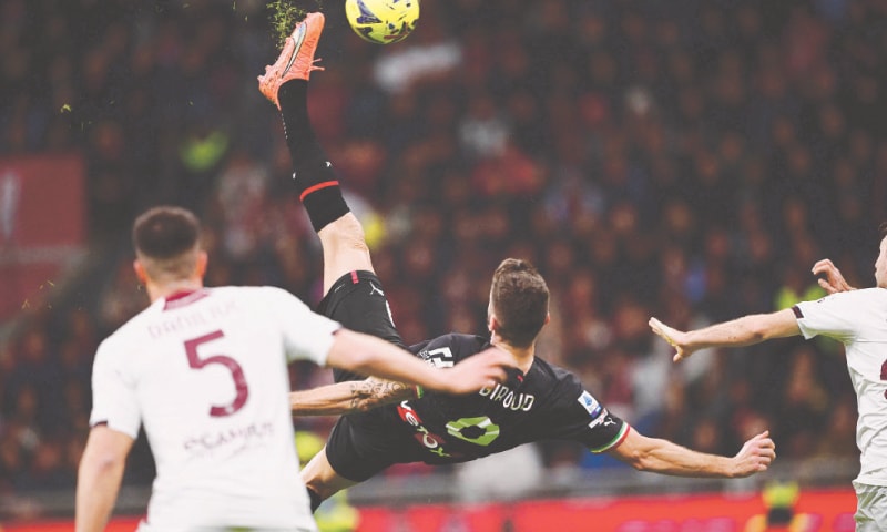 AC Milan&rsquo;s Olivier Giroud scissor-kicks during the Serie A match against Salernitana at the San Siro Stadium.&mdash;AFP