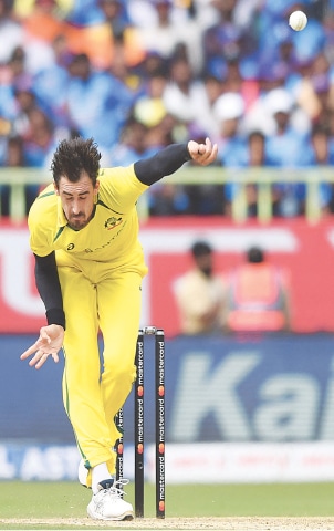  Australian pacer Mitchell Starc bowls during the second One-day International against India at the Y.S. Rajasekhara Reddy Cricket Stadium on Sunday.—AFP 