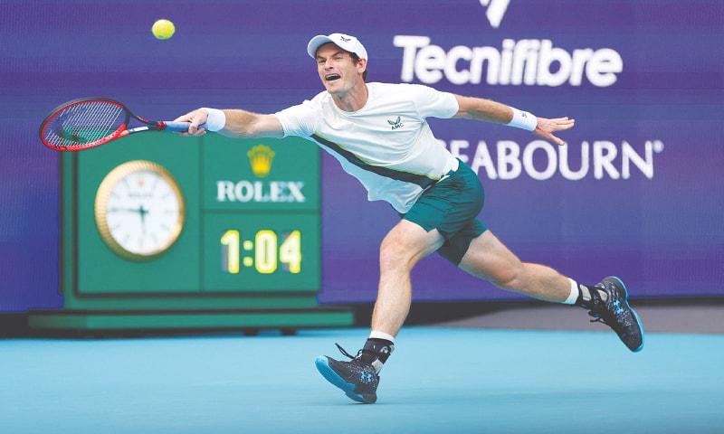 Andy Murray of Great Britain stretches to play a return against Serbia’s Dusan Lajovic during their Miami Open first-round match at the Hard Rock Stadium.—AFP Andy Murray of Great Britain stretches to play a return against Serbia’s Dusan Lajovic during their Miami Open first-round match at the Hard Rock Stadium.—AFP