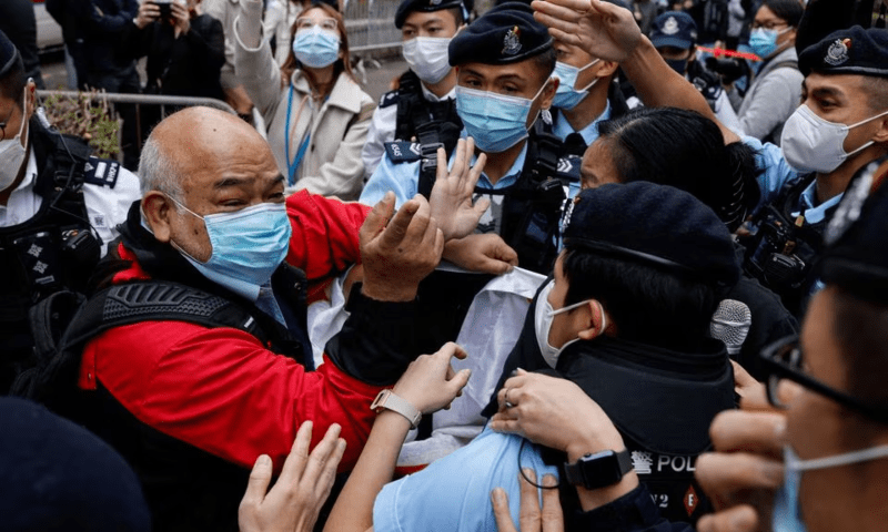 A supporter scuffles with police the West Kowloon Magistrates’ Courts building during the hearing of the 47 pro-democracy activists charged with conspiracy to commit subversion under the national security law, in Hong Kong, China February 6, 2023. — Reuters