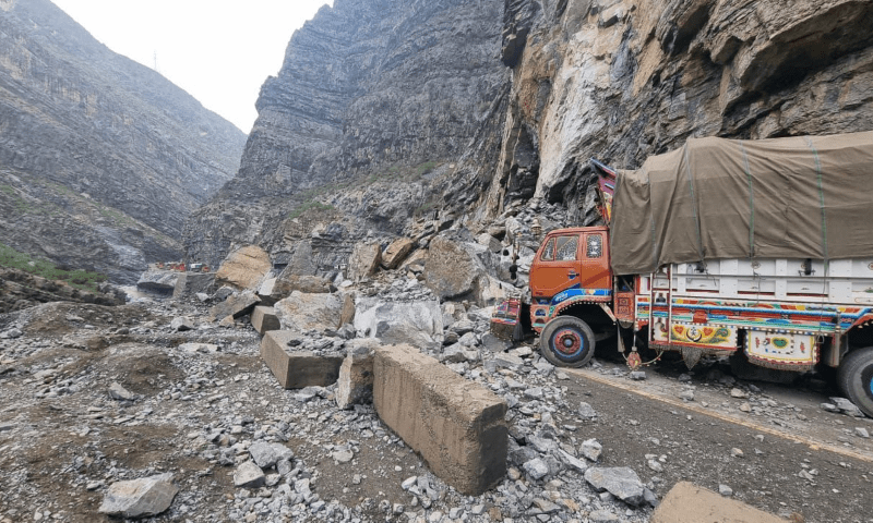 A truck stands on the N-50 national highway on April 2 after the road has been blocked off due to a landslide following torrential rains in KP. — Photo provided by author