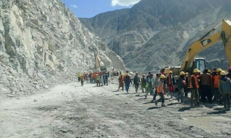 Workers seen at the  site of under-construction Diamer Bhasha dam in Gilgit Baltistan after an explosion occurred there during rock blasting on Friday afternoon. &mdash; Photo by Umar Bacha