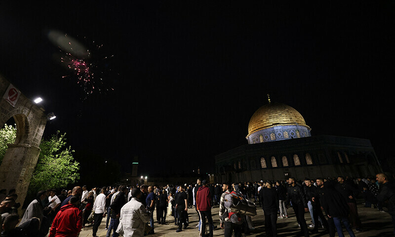 Muslim worshippers gather on the first day of Eidul Fitr outside the Dome of the Rock at the Al-Aqsa mosques complex in the Old City of Jerusalem, April 21. — AFP