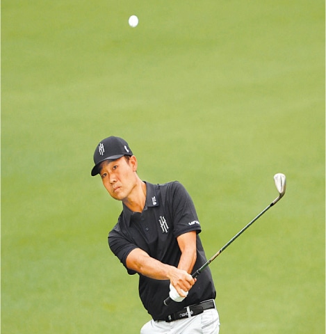 KEVIN Na of the US plays a shot on the second hole during the first round of the Masters Tournament at Augusta National Golf Club on Thursday.—AFP