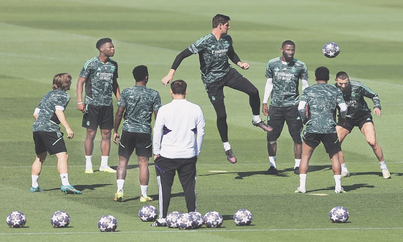 MADRID: Real Madrid players take part in a training session at Valdebebas Sport City on Tuesday.&mdash;AFP