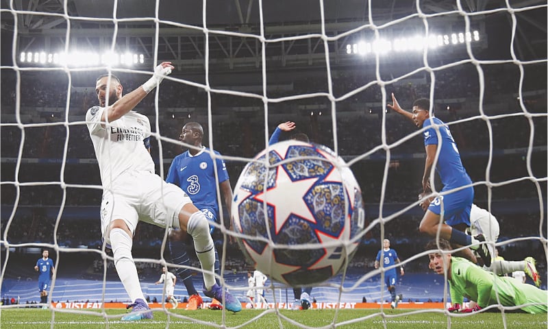 MADRID: Real Madrid&rsquo;s Karim Benzema (L) scores during the Champions League quarter-final first leg against Chelsea at the Santiago Bernabeu.&mdash;Reuters