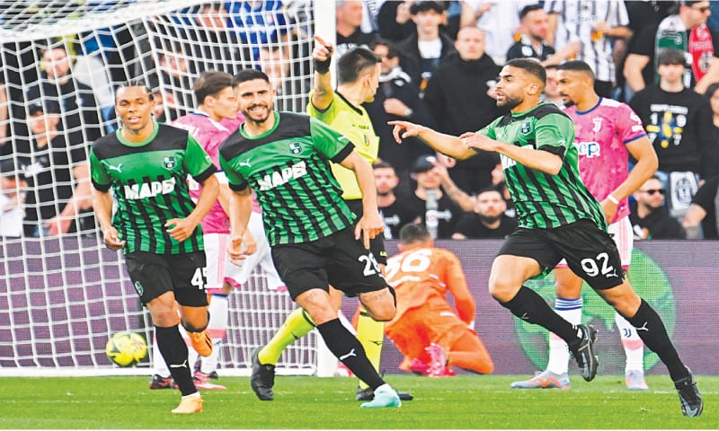 SASSUOLO: Gregoire Defrel (R) of Sassuolo celebrates with team-mates after scoring against Juventus during their Serie A match at the Mapei Stadium.—AFP SASSUOLO: Gregoire Defrel (R) of Sassuolo celebrates with team-mates after scoring against Juventus during their Serie A match at the Mapei Stadium.—AFP