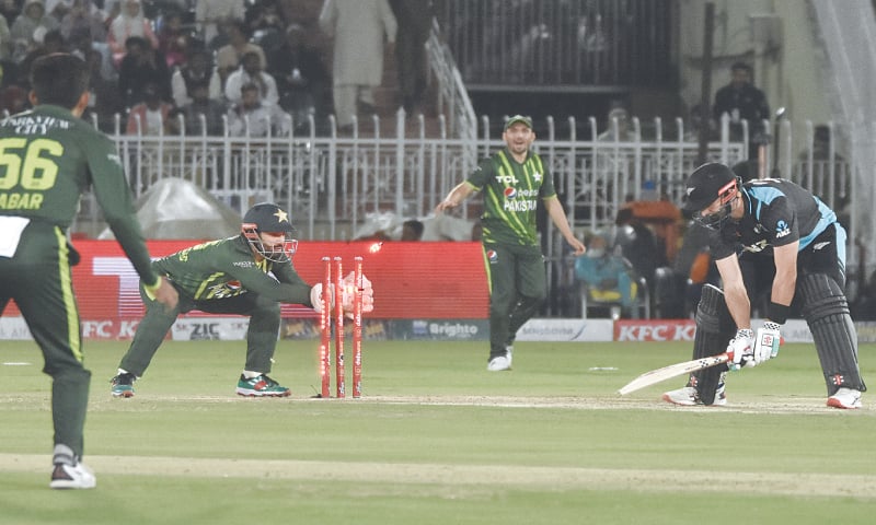  NEW ZEALAND batter Daryl Mitchell is stumped by Pakistan wicket-keeper Mohammad Rizwan off spinner Imad Wasim (not pictured) during the fourth Twenty20 International at the Pindi Cricket Stadium on Thursday.—Tanveer Shahzad/White Star 