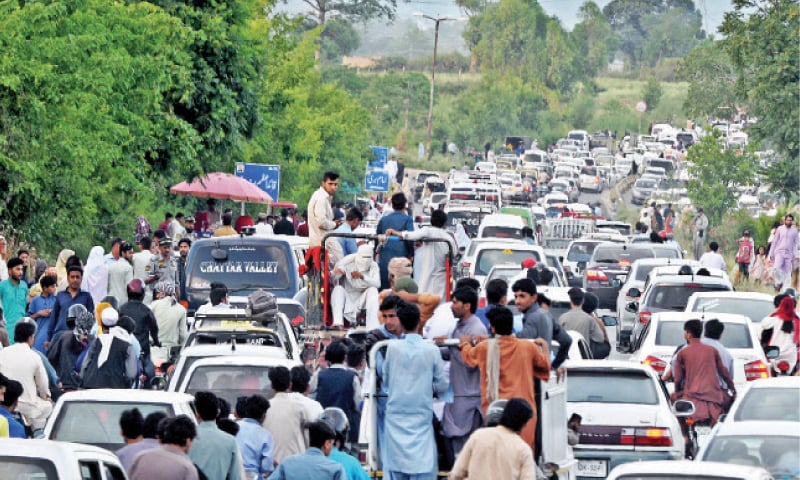Traffic moves at a snail&rsquo;s pace on Murree Road in Islamabad on Monday. &mdash; White Star