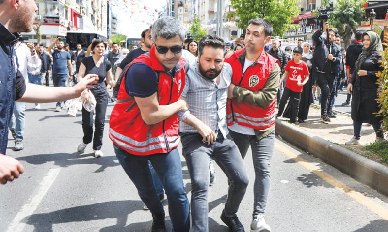 Diyarbakir: Security officials detain protesters demonstrating against the detention of people over alleged militant ties on Tuesday.—Reuters Diyarbakir: Security officials detain protesters demonstrating against the detention of people over alleged militant ties on Tuesday.—Reuters