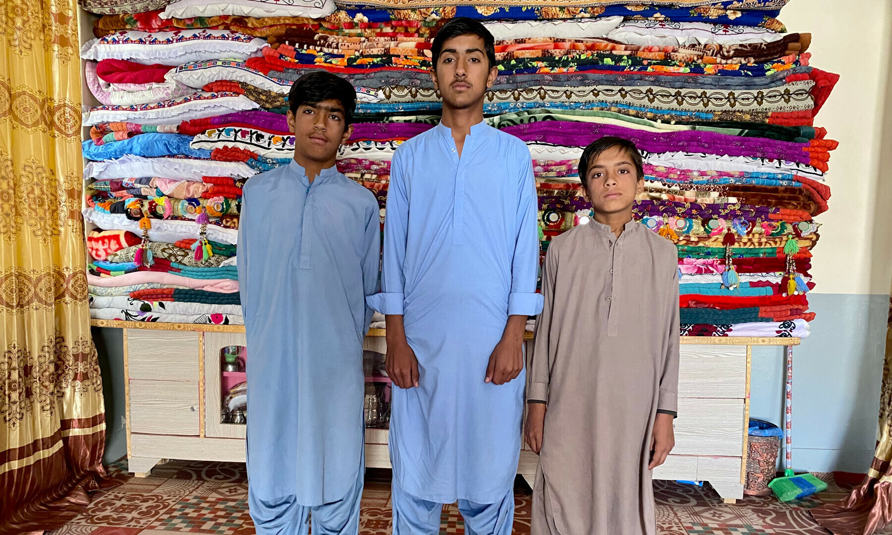 Slain journalist Mohammed Khan Sasoli’s three sons.