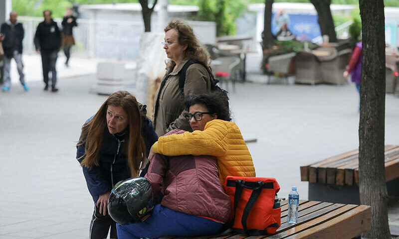 People react after a 14-year-old boy opened fire on other students and security guards at a school in downtown Belgrade, Serbia, May 3, 2023. —Reuters