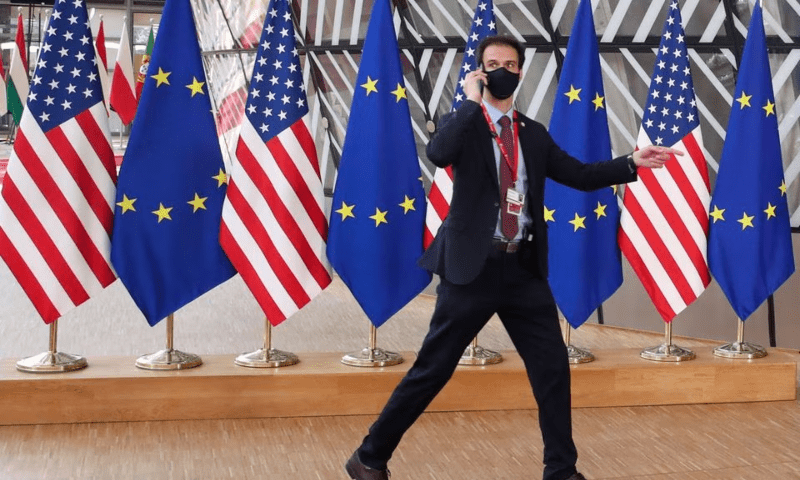 A security guard walks near EU and US flags, before the EU-US summit, in Brussels, Belgium on June 15, 2021. — Reuters A security guard walks near EU and US flags, before the EU-US summit, in Brussels, Belgium on June 15, 2021. — Reuters