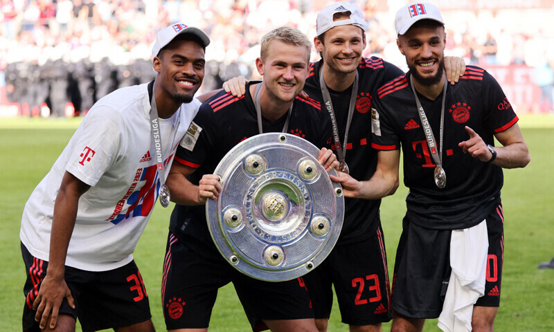 Bayern Munich’s Ryan Gravenberch, Matthijs de Ligt, Daley Blind and Noussair Mazraoui pose with the trophy after winning the Bundesliga. — Reuters