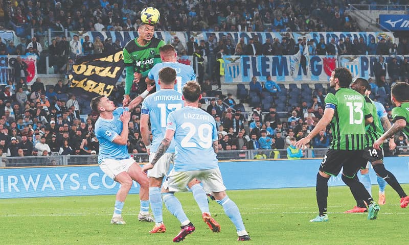 ROME: Sassuolo&rsquo;s Ruan Tressoldi (top L) goes for a header during the Serie A match against Lazio at Stadio Olimpico.&mdash;AFP