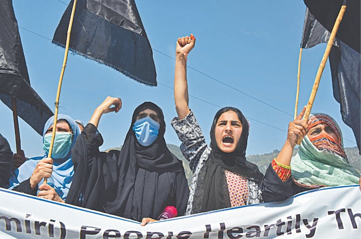 MUZAFFARABAD: Activists of Pasban-i-Hurriyat, a Kashmiri refugee organisation, stage a protest demonstration against the holding of G20 meeting in India-held Kashmir, on Monday.—AFP