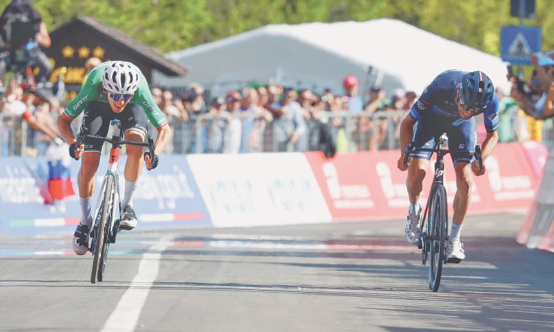 Team Jayco AlUla’s Italian rider Filippo Zana (L) sprints towards the finish line with Groupama-FDJ’s Thibaut Pinot of France during the 18th stage of the Giro d’Italia on Thursday.—AFP Team Jayco AlUla’s Italian rider Filippo Zana (L) sprints towards the finish line with Groupama-FDJ’s Thibaut Pinot of France during the 18th stage of the Giro d’Italia on Thursday.—AFP