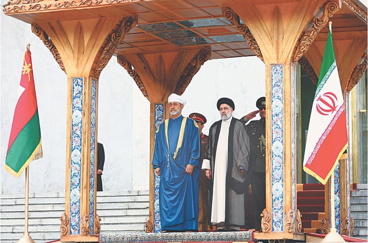    IRANIAN President Ebrahim Raisi welcomes Sultan of Oman Haitham bin Tariq al-Said at the Presidential Palace in Tehran, on Sunday.—AFP   